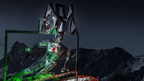The "Gigant" of Alta Badia illuminated with the Italian flag to give a signal of hope